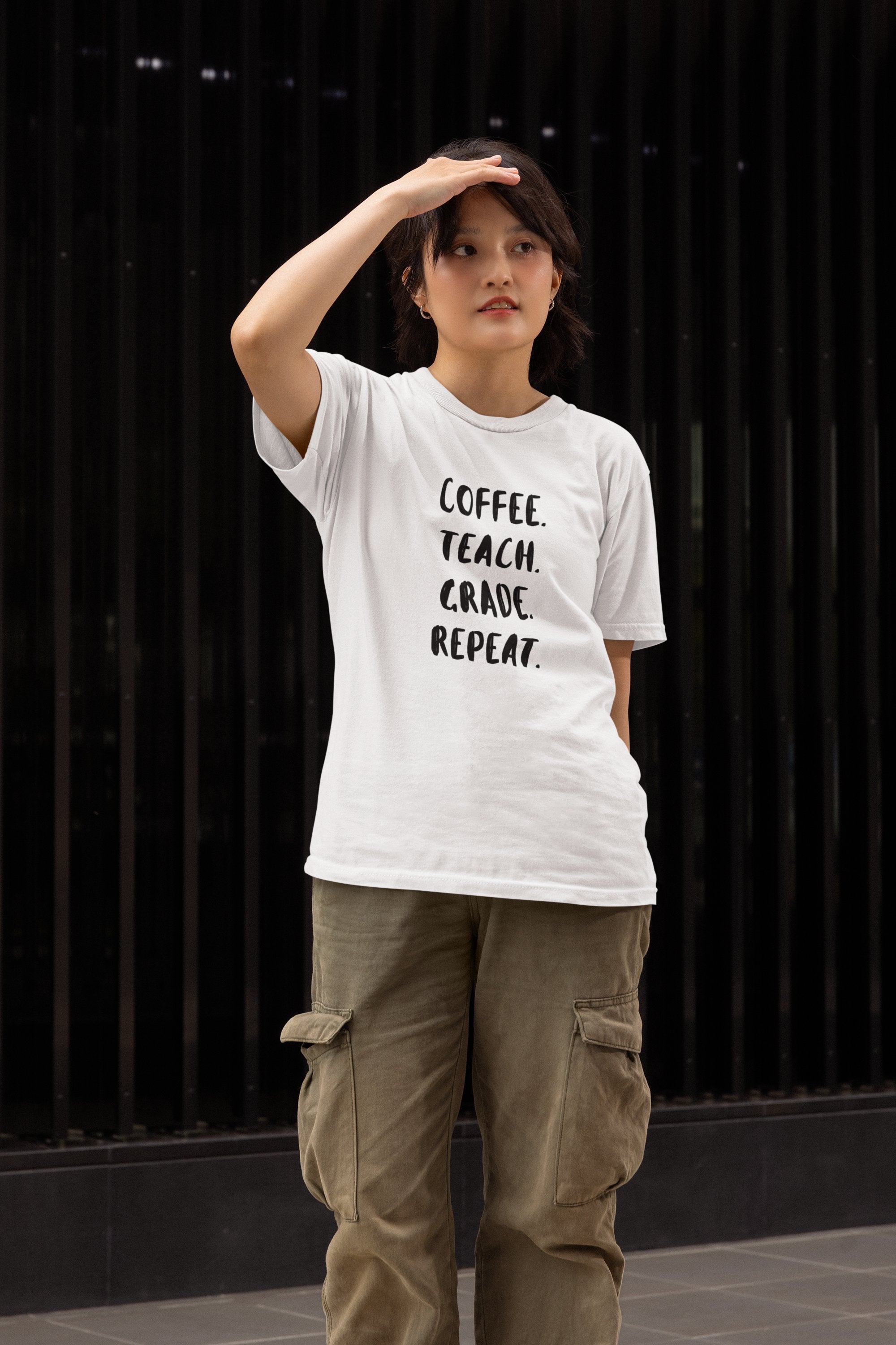 a woman wearing a teacher shirt